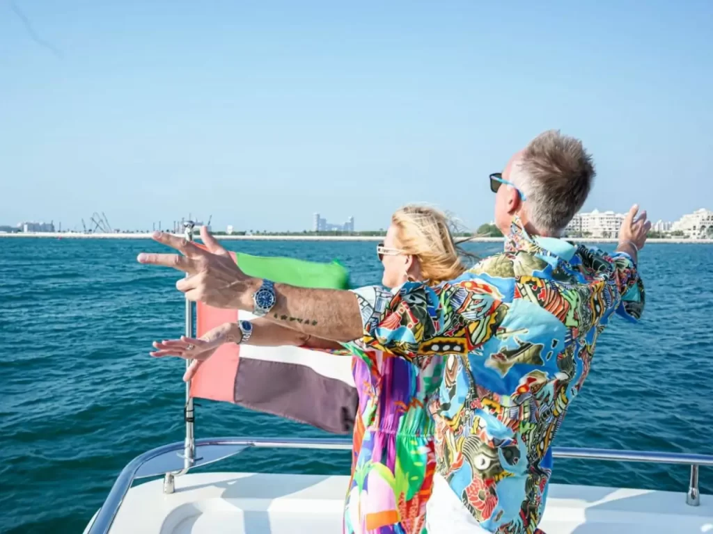 elite yacht rental couple enjoying a ride in a yacht rental in dubai.